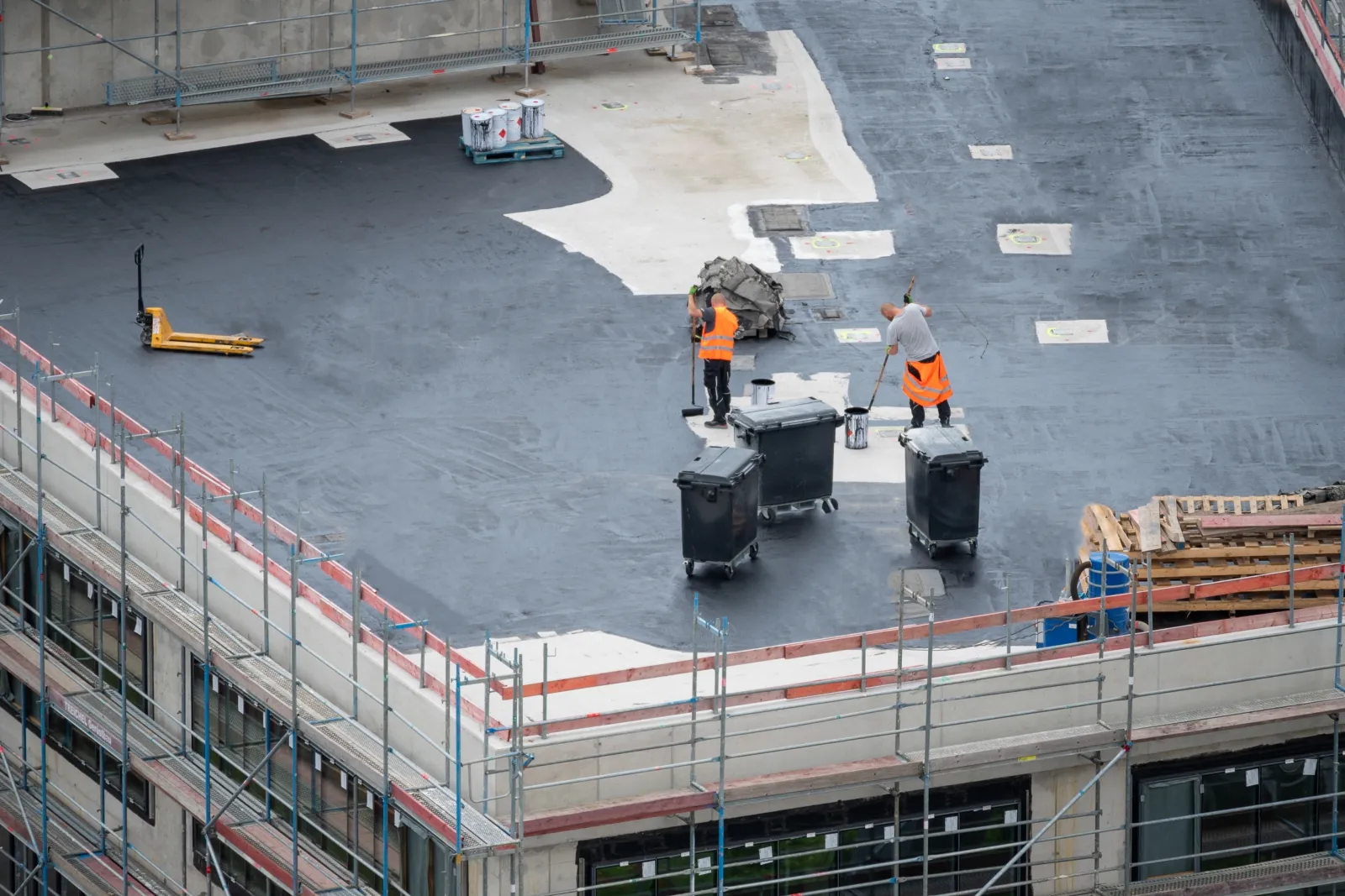 Workers working on flat roof