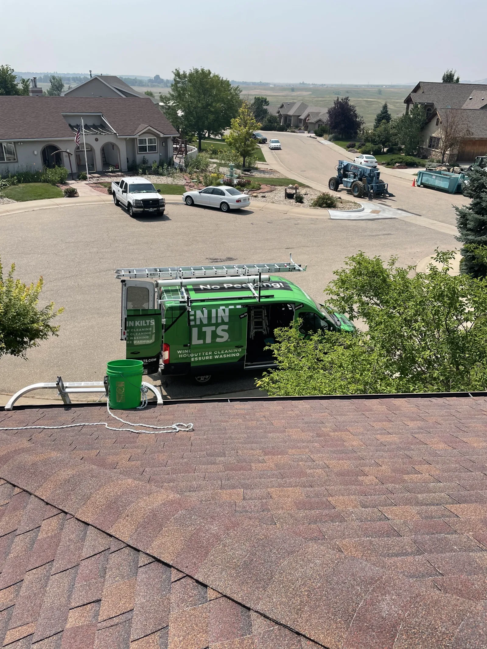 a green machine on a roof