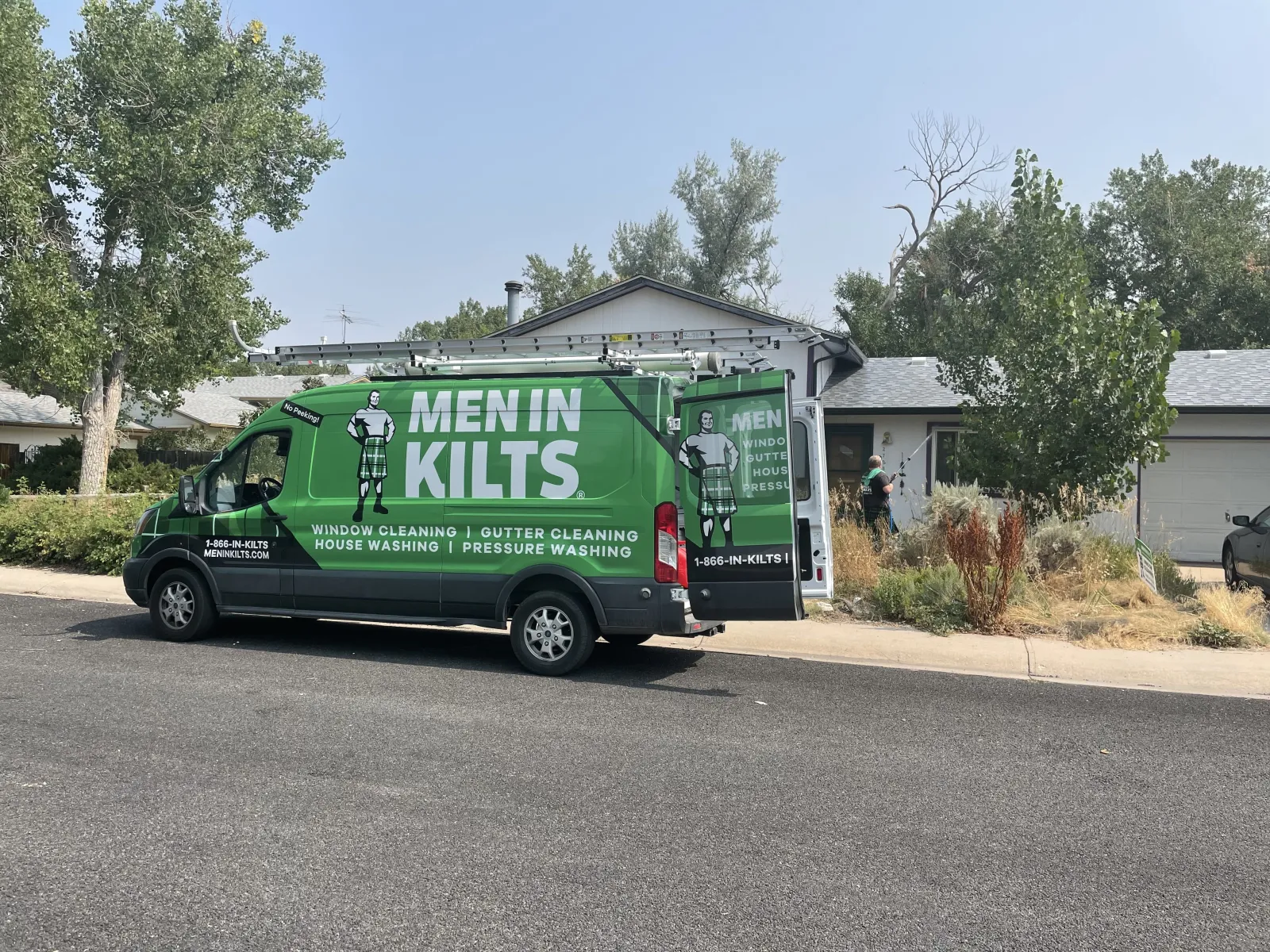 a green truck on the street