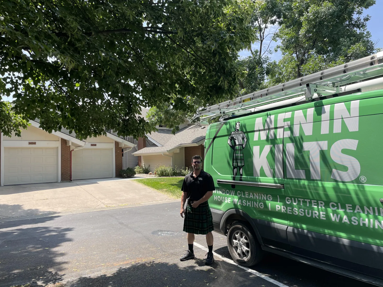 a person standing next to a green truck