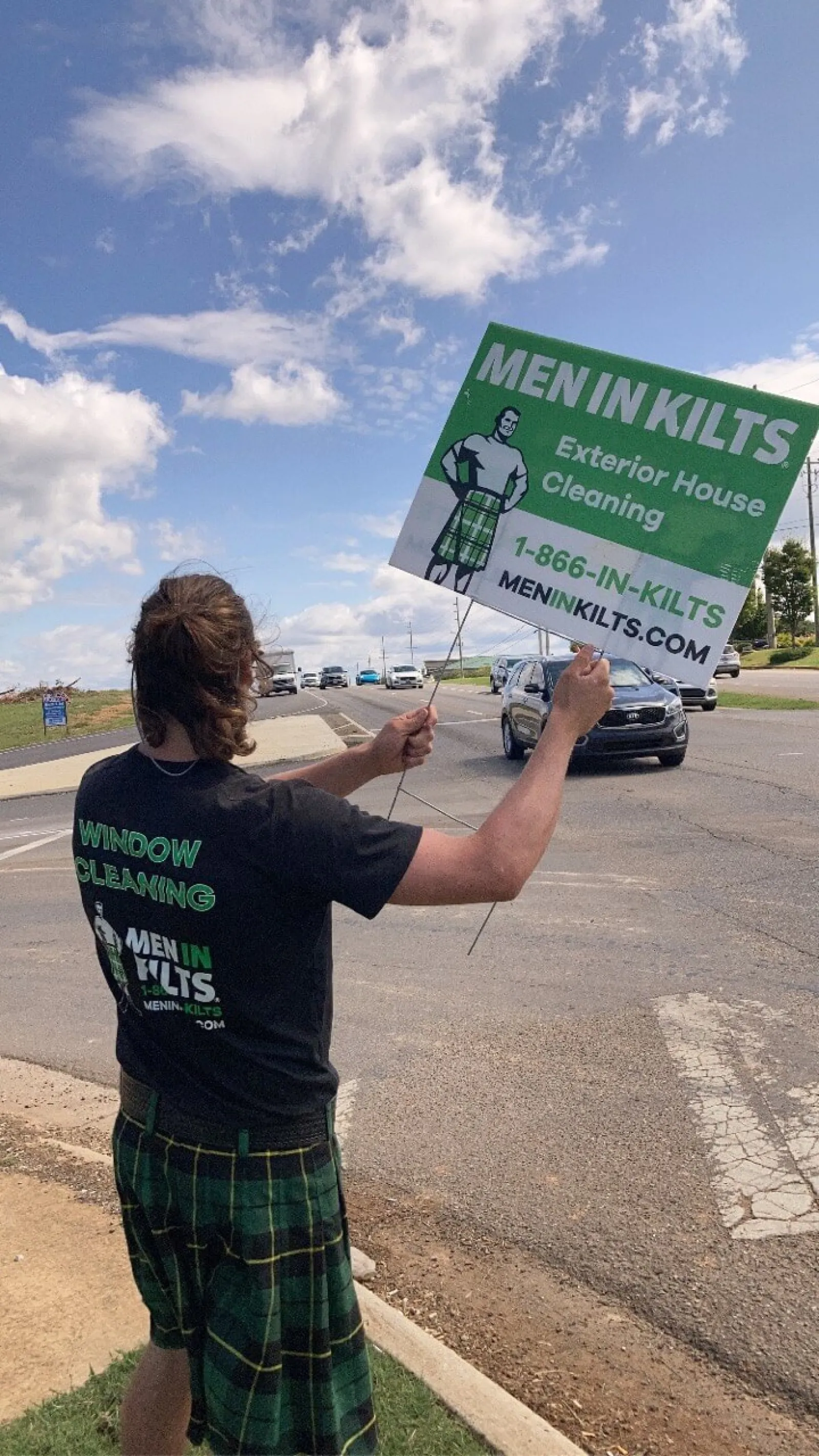 a man holding a sign