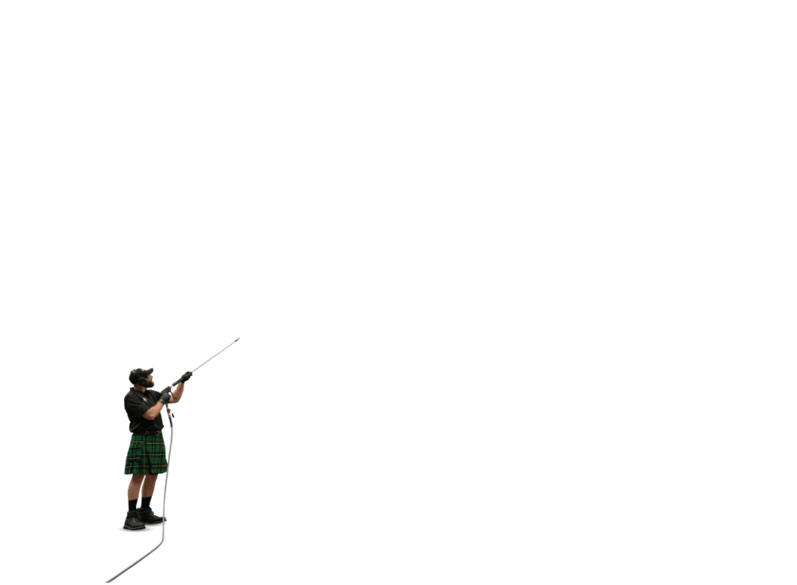 Man in a green kilt spraying water upwards using a high-pressure hose against a black background.