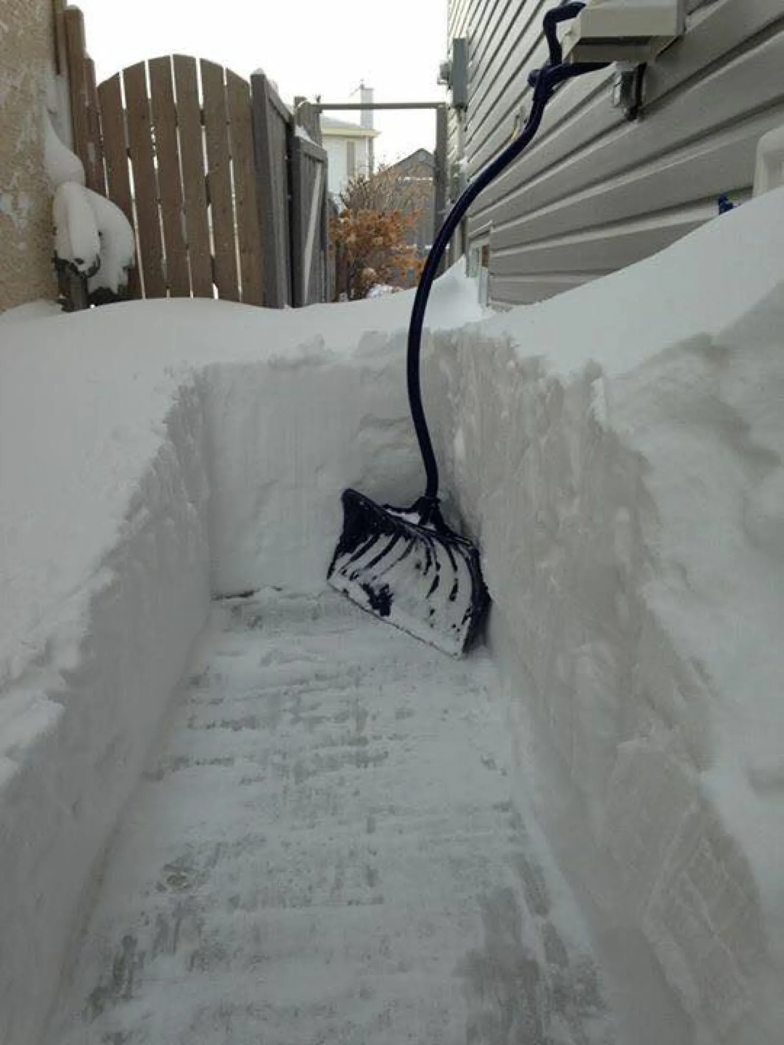 a snow covered sidewalk