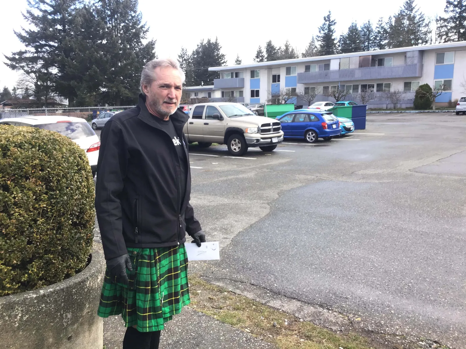 a person standing in a parking lot