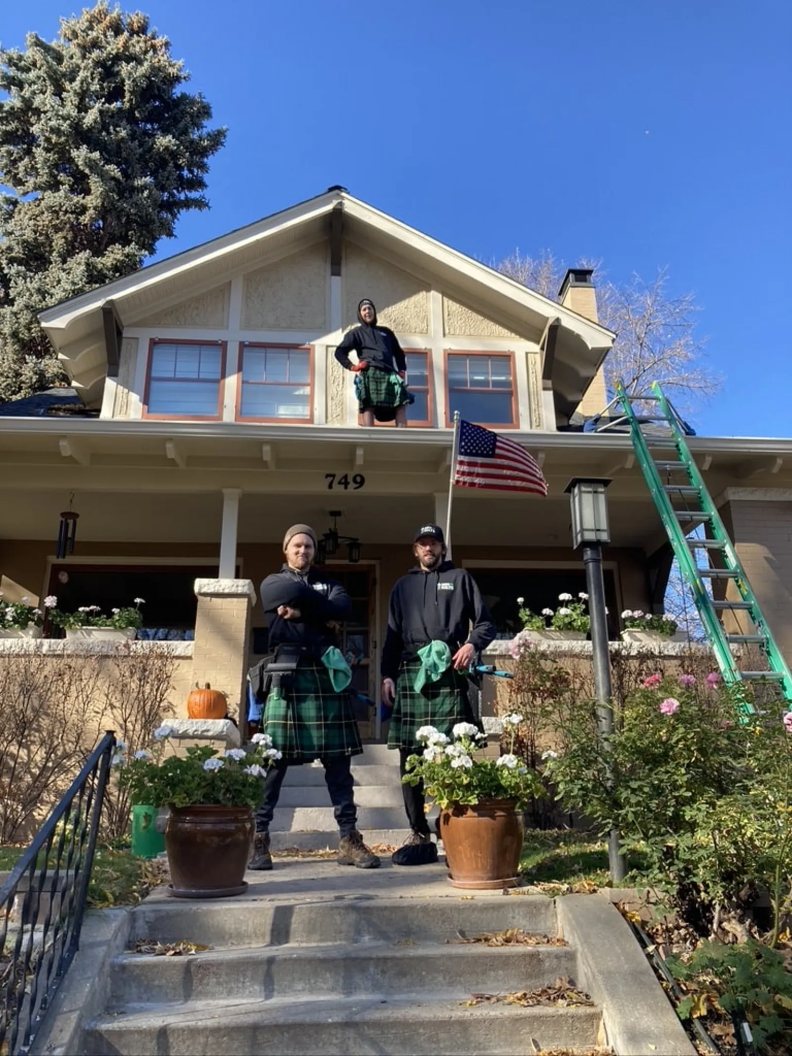 a group of people standing on stairs outside of a house