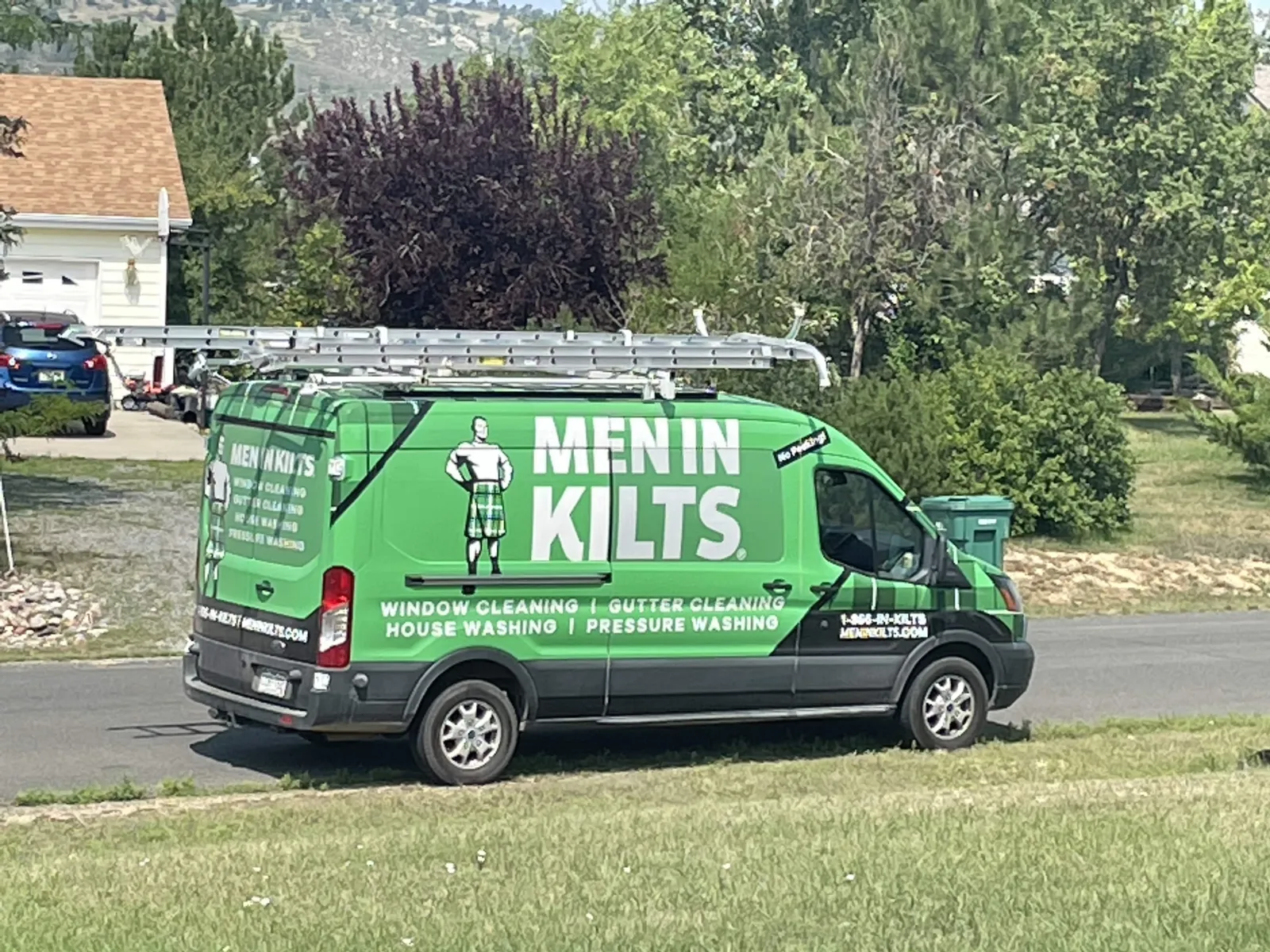 a green van with a sign on it