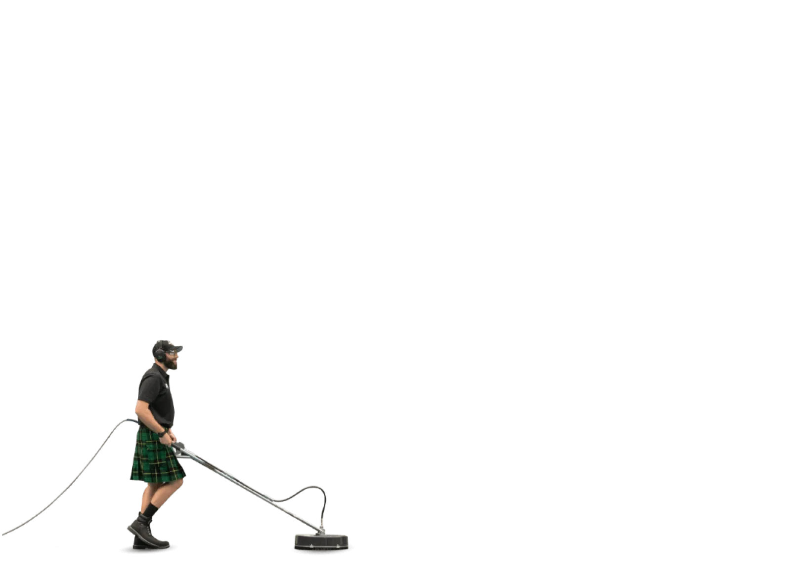 Man wearing a kilt using a surface cleaner tool with protective headphones and boots on a black background.