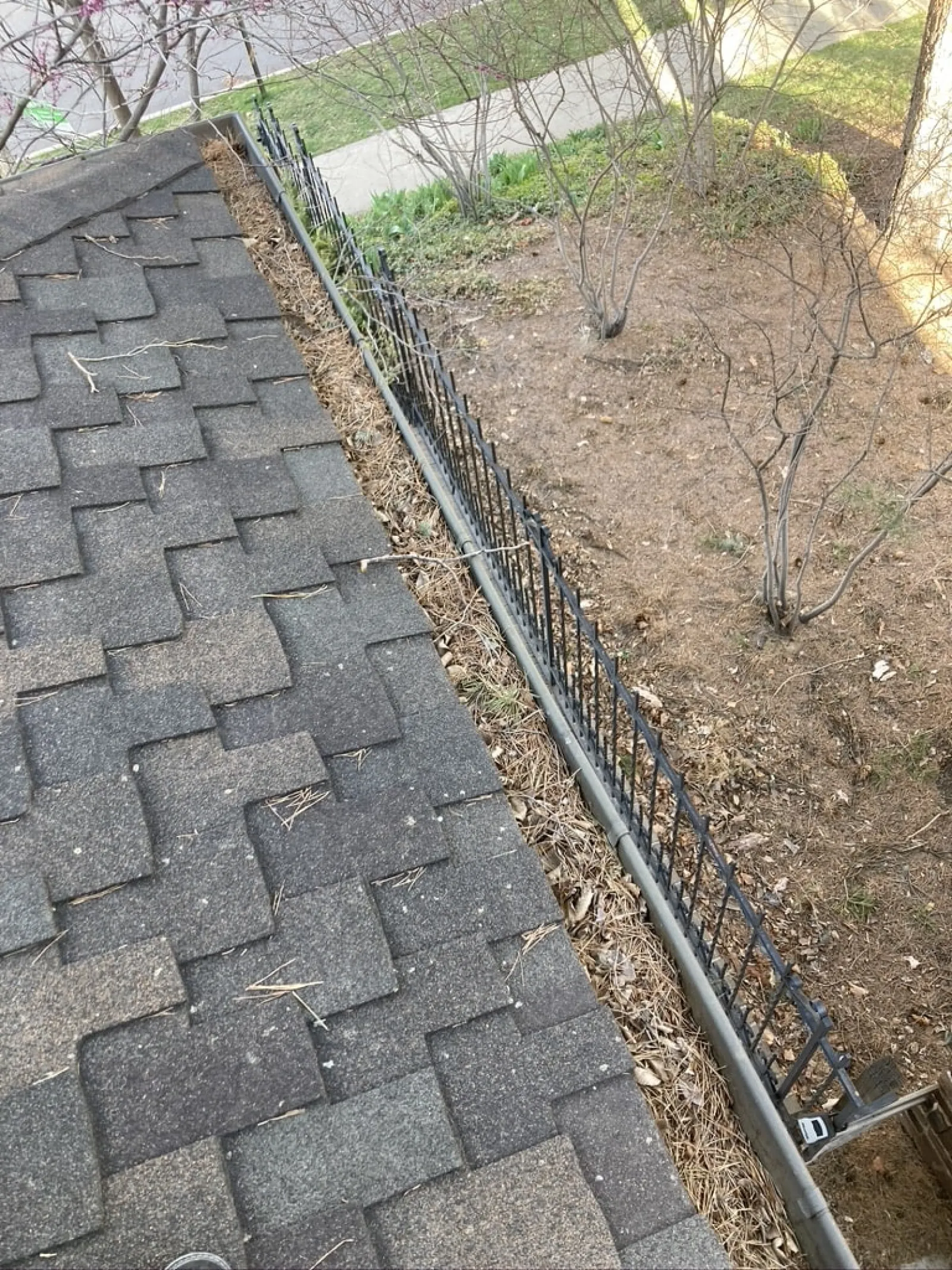 a stone walkway with a fence