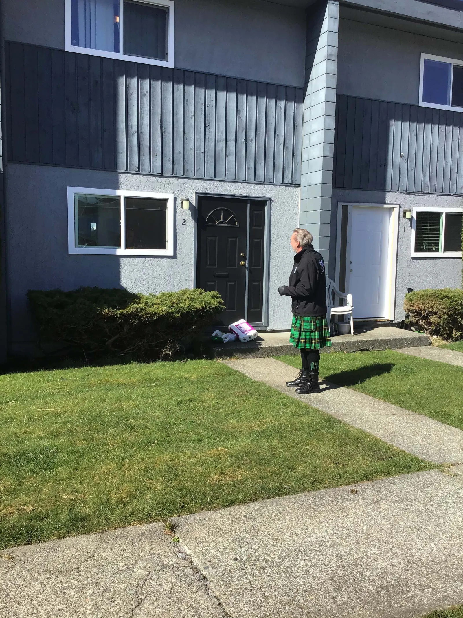 a person standing outside a house