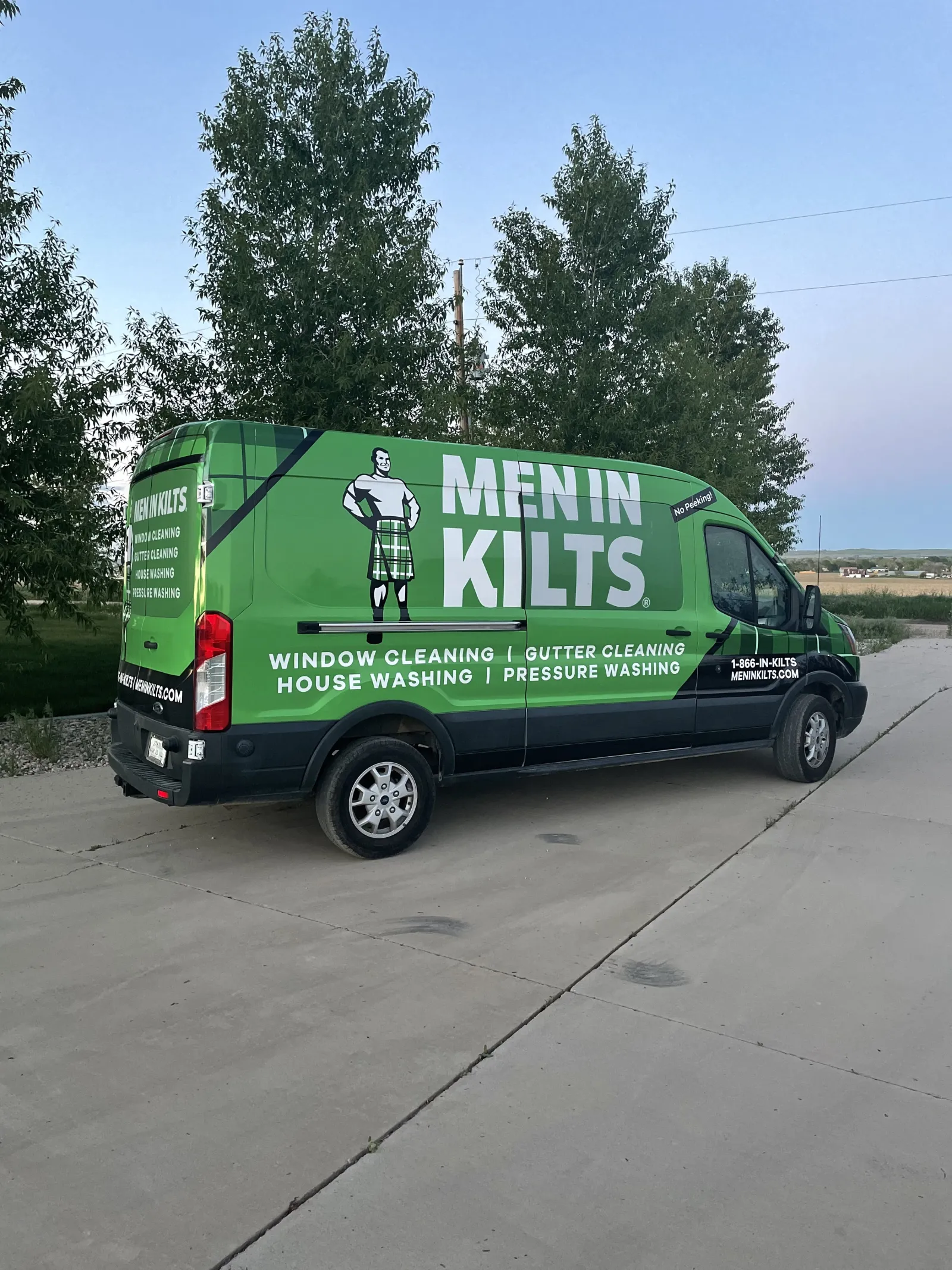 a green van with a white sign on it