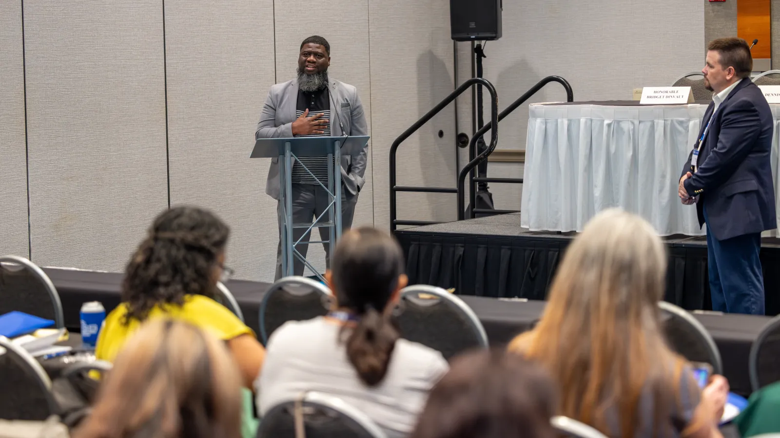 a person speaking to a group of people