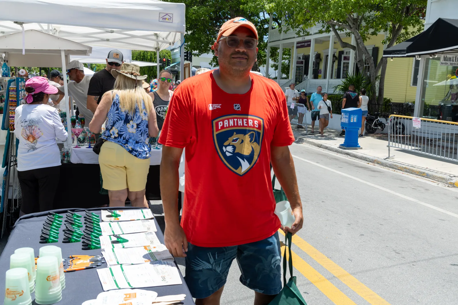 a man standing next to a table