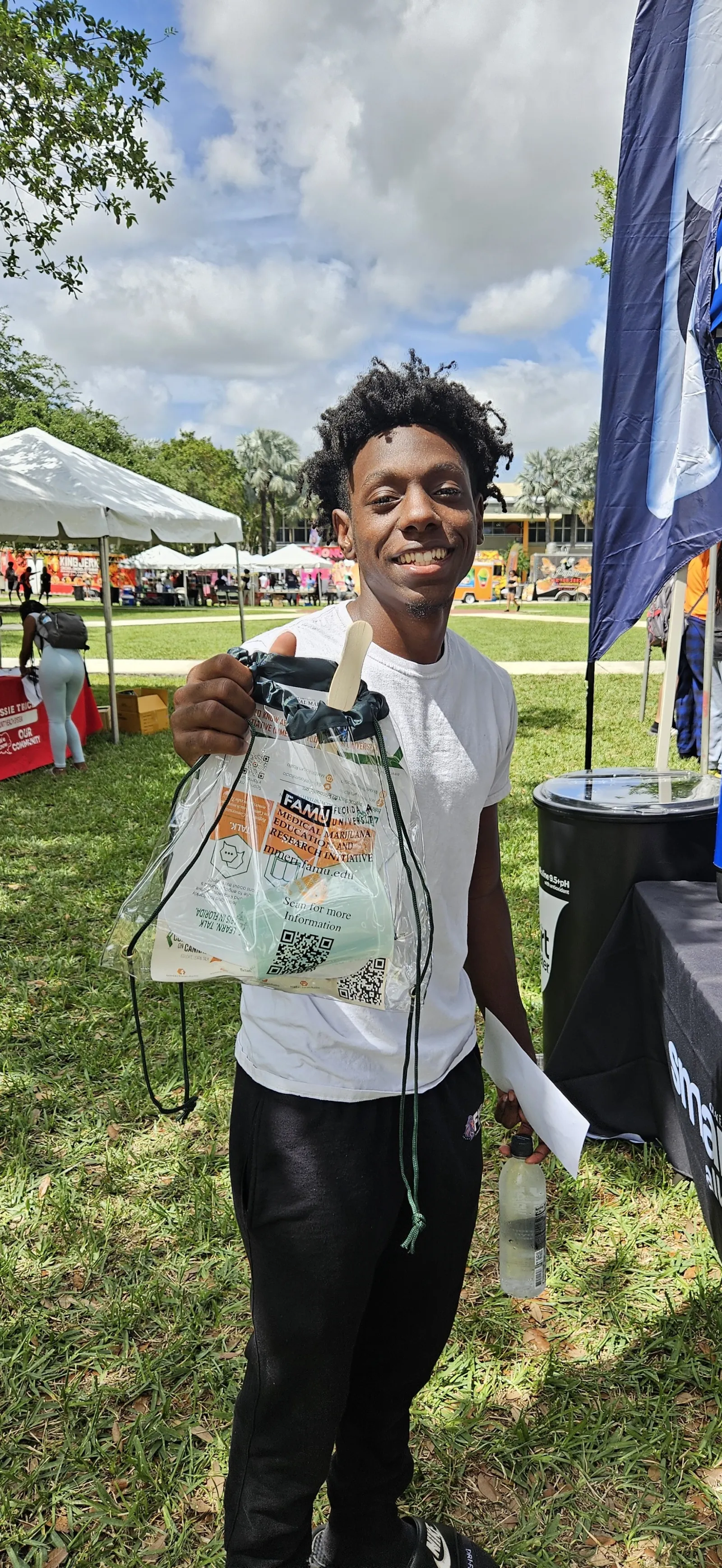 a person holding a bag of food