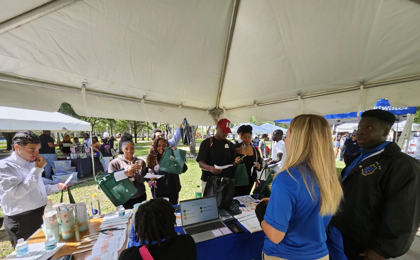 a group of people at a tent