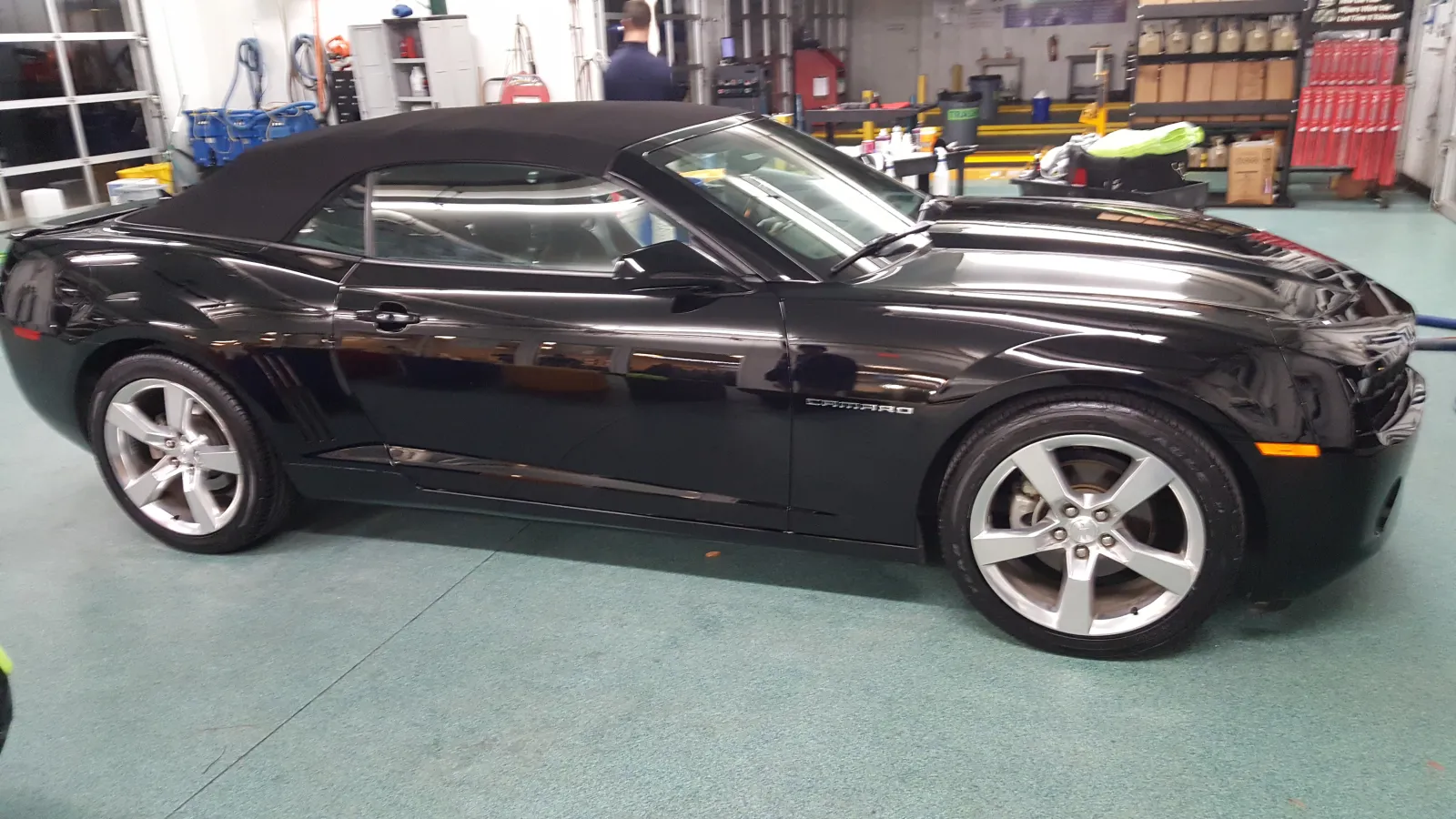 a black car parked in a garage