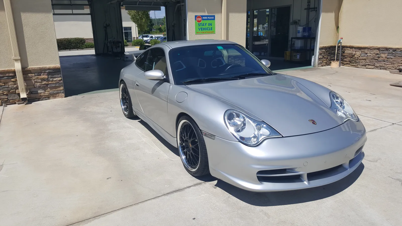 a silver car parked in a parking lot