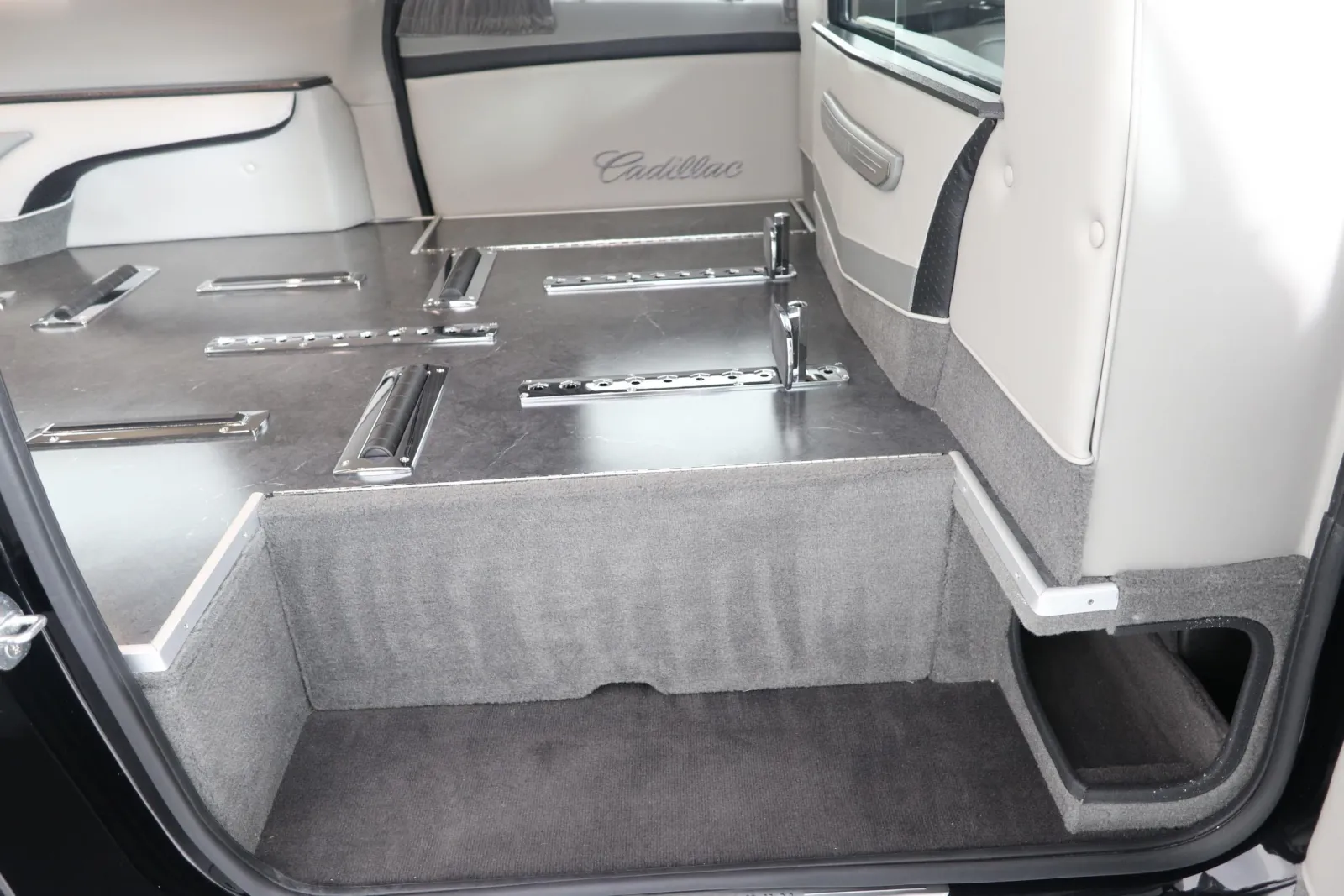 Spacious interior of a Cadillac vehicle showcasing luxury and sleek design elements.