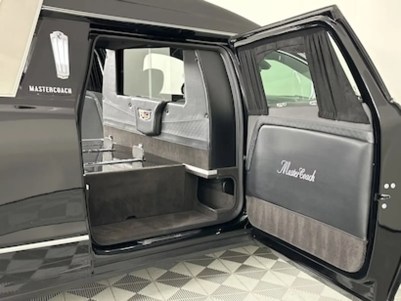 Luxurious black limousine interior highlighting spaciousness and elegant design features.