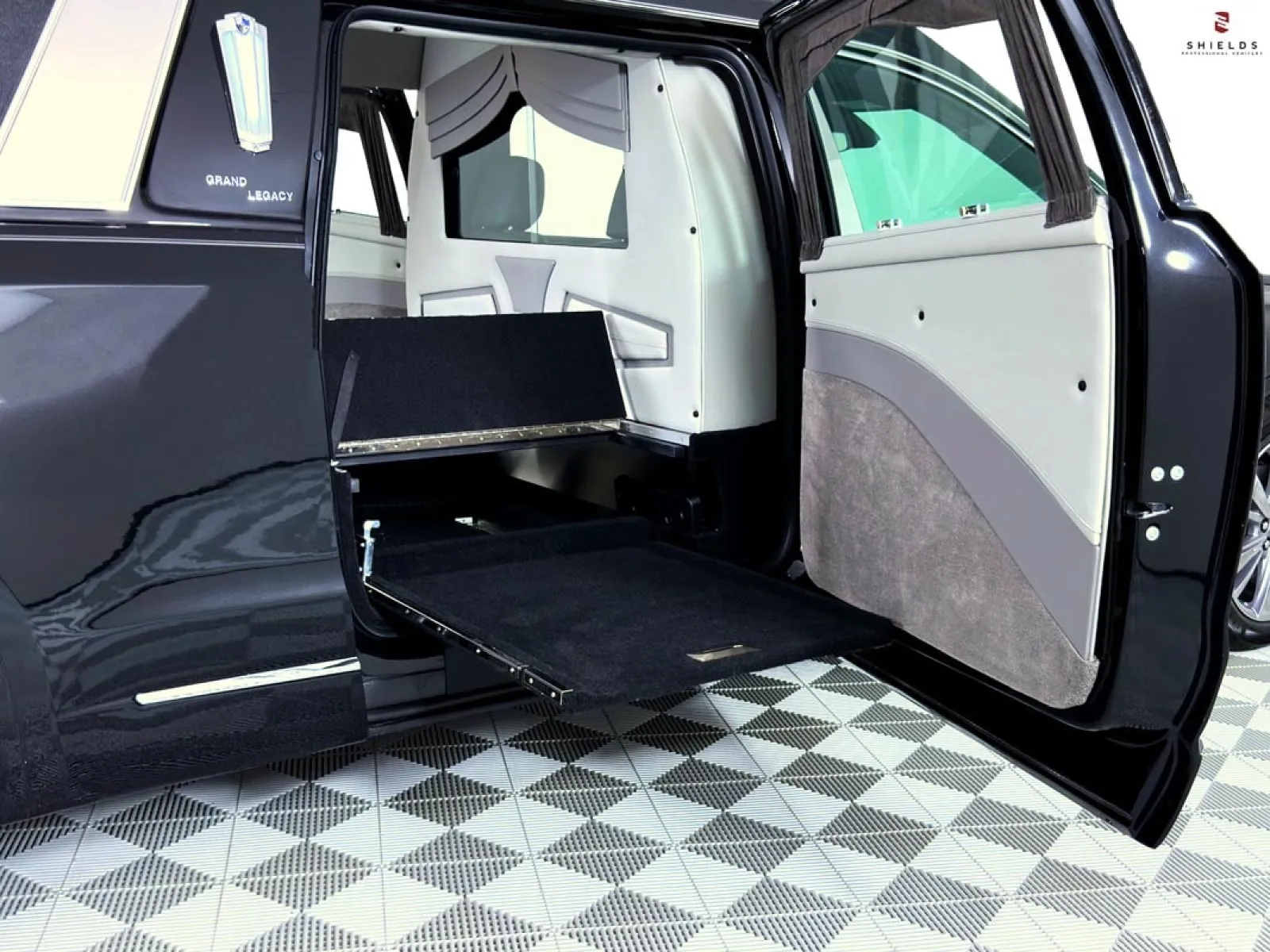 Elegantly designed hearse interior with a retractable platform and premium finishes.