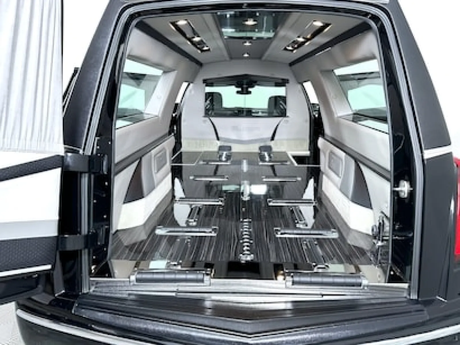 Interior view of a luxury hearse showcasing stylish seating and premium finishes.