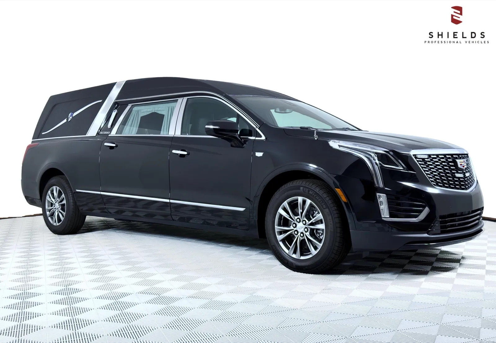 Elegant black Cadillac hearse showcasing sleek design and premium features, ideal for professional services.