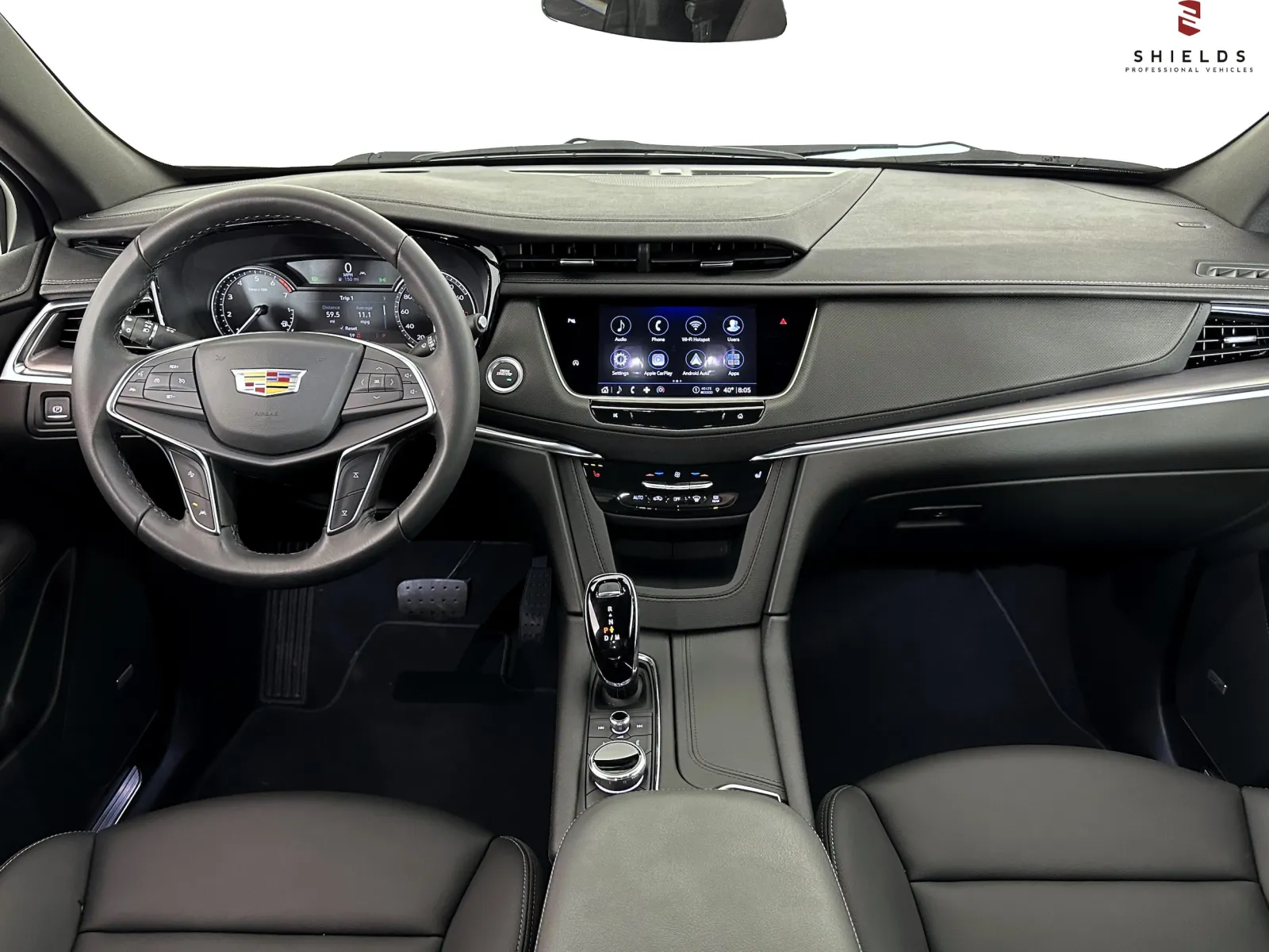 Interior view of a modern Cadillac featuring a sleek dashboard and advanced technology interface.