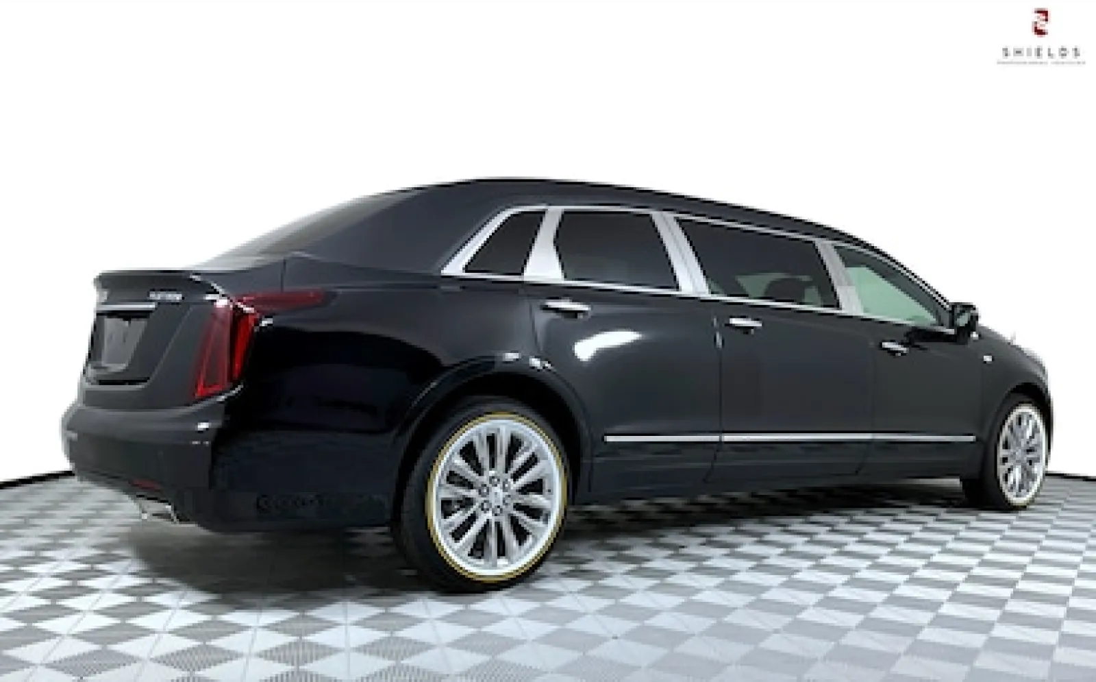 Black luxury limousine showcasing sleek design and stylish wheels.