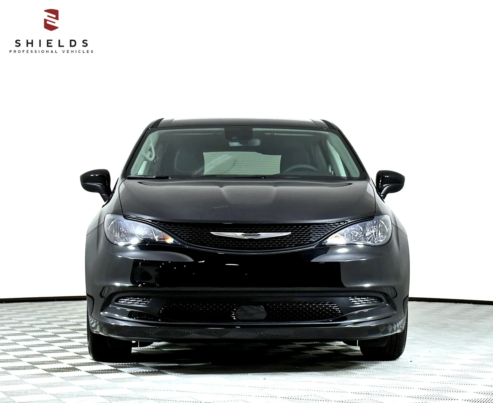 Front view of a sleek black Chrysler vehicle on a white background.