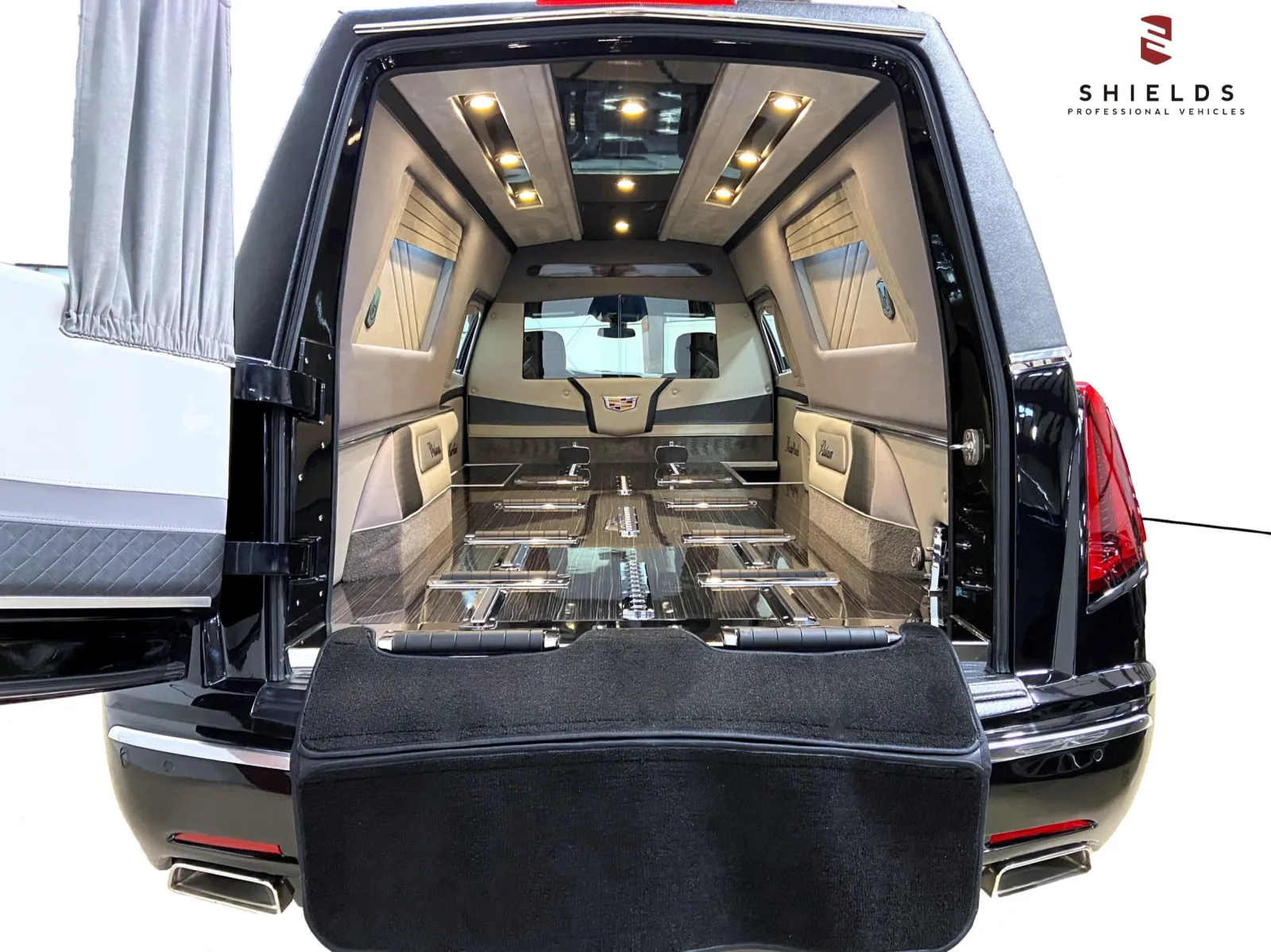 Spacious interior of a luxury hearse showcasing sleek design and elegant finishes.
