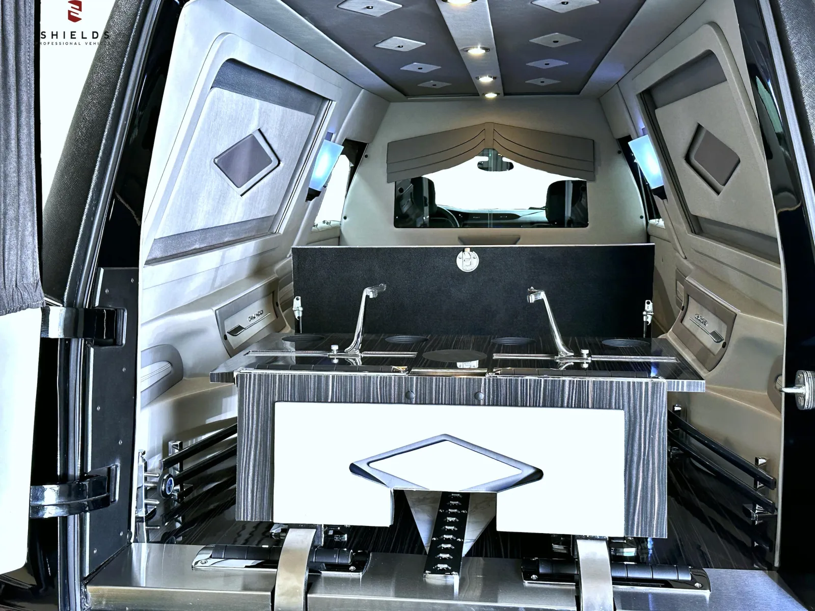 Luxurious vehicle interior featuring dual sinks and elegant finishes for comfort and style.