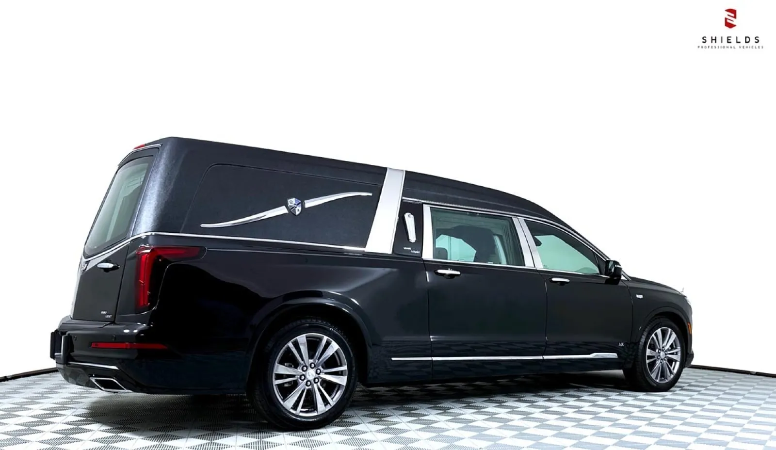A sleek black hearse with elegant details, showcasing modern professional design.