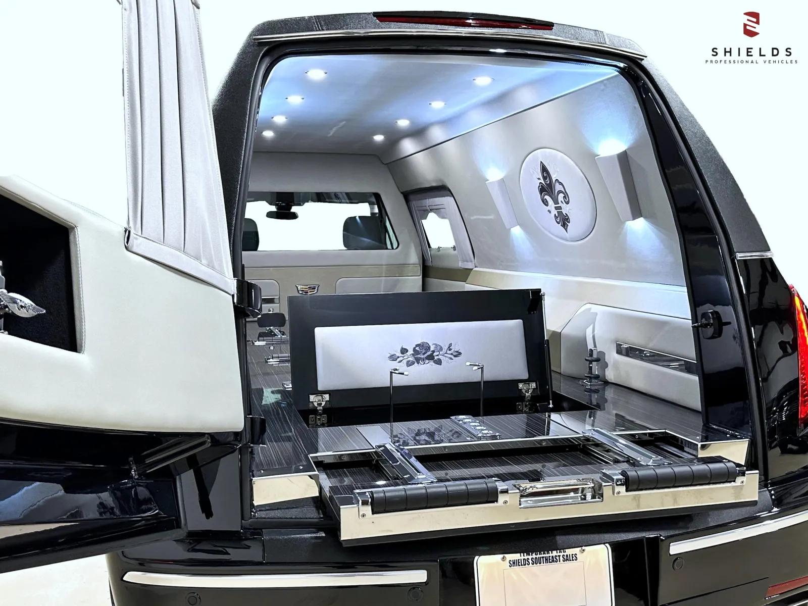 Sleek, luxury hearse interior with elegant design and stylish lighting features.