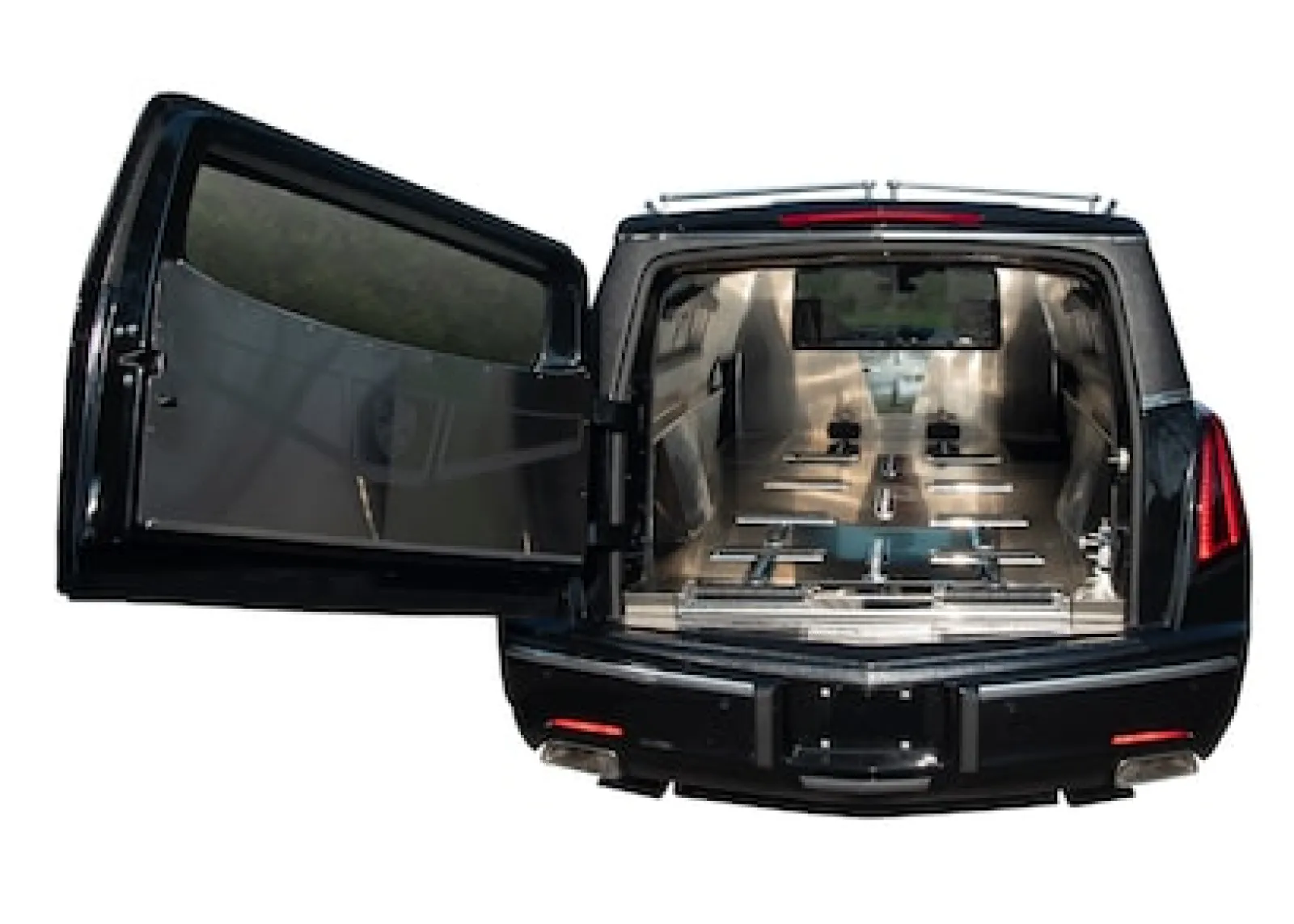 Interior view of an elegant hearse with spacious compartments for transporting caskets.