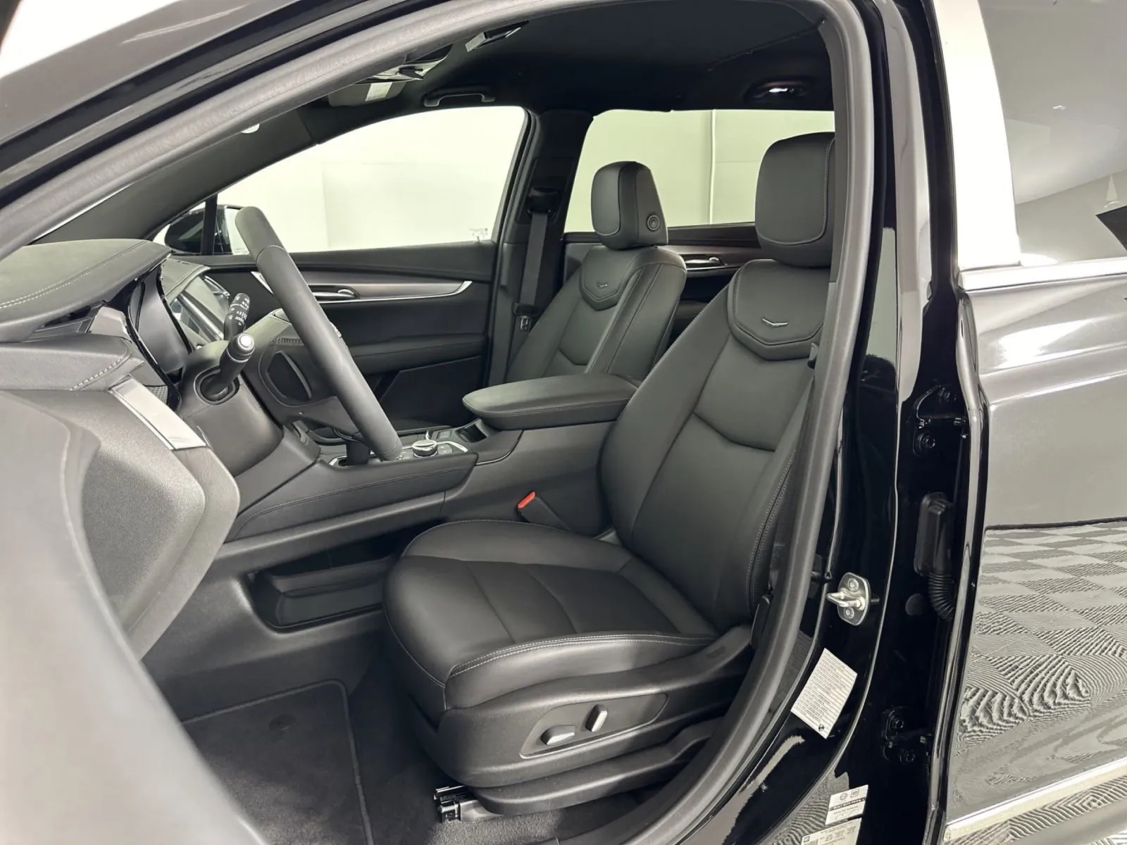 Interior view of a modern car featuring comfortable black leather seats and stylish dashboard design.
