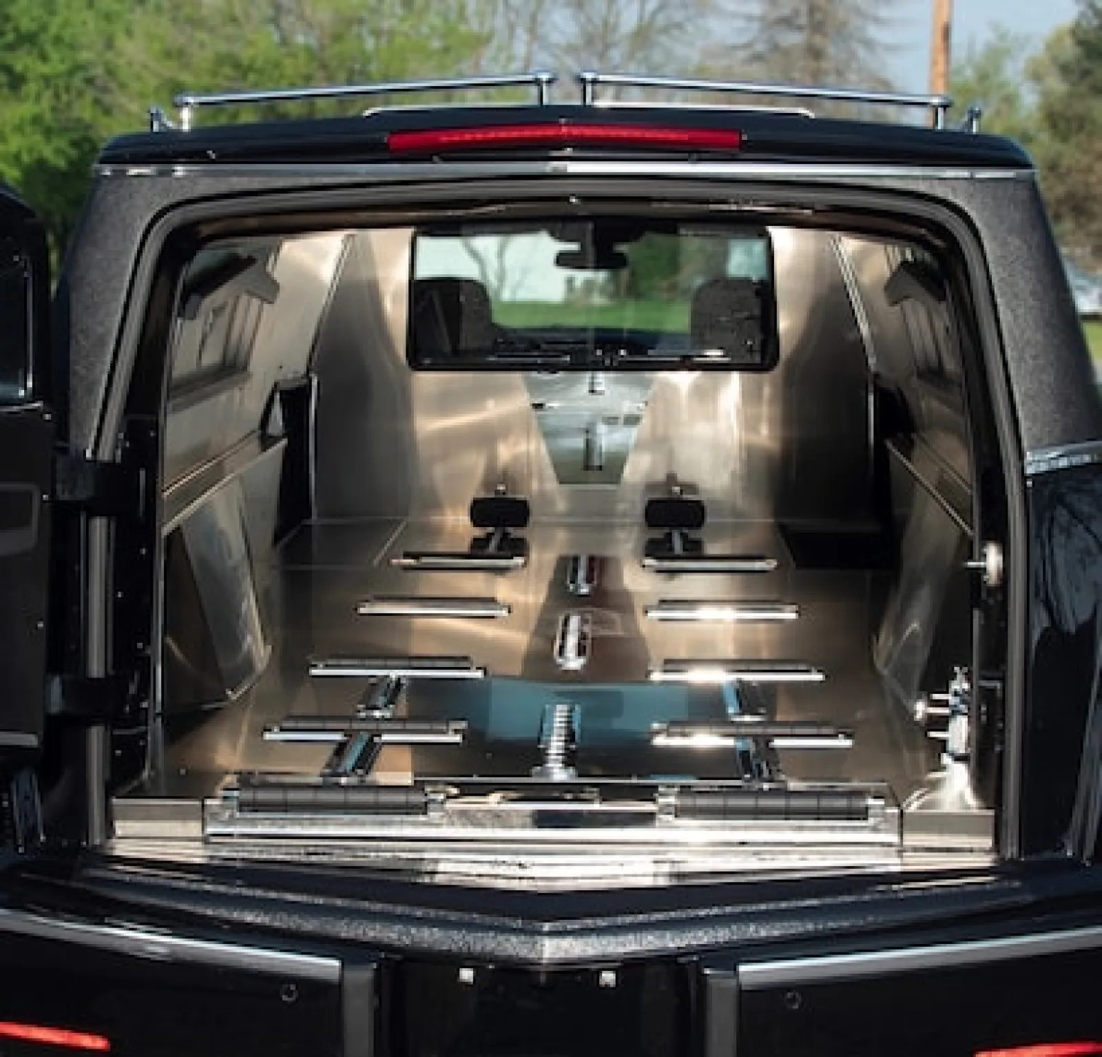 Interior view of a sleek, metallic truck bed designed for utility and functionality.