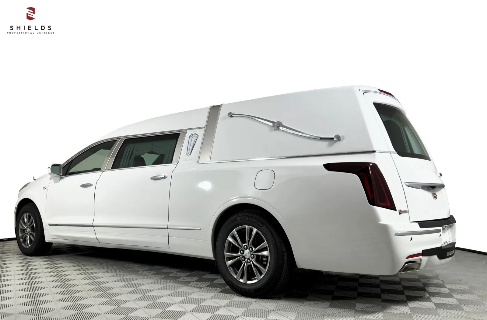 Sleek white hearse with elegant design, showcasing professionalism and comfort for funeral services.