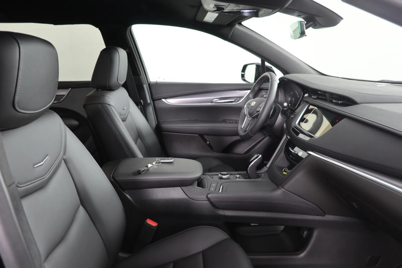Interior view of a modern car showcasing sleek black leather seats and a stylish dashboard design.