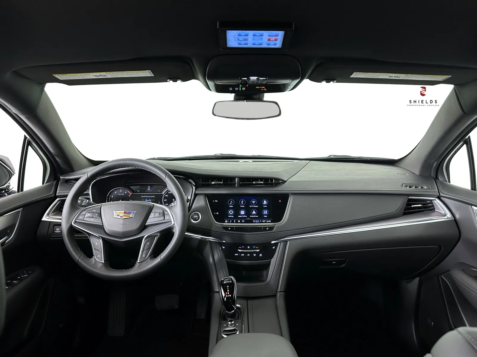 Stylish Cadillac car interior showcasing modern dashboard and touchscreen features.