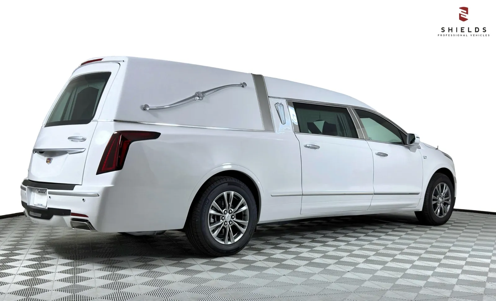 White Cadillac hearse showcasing sleek design and professional detailing.