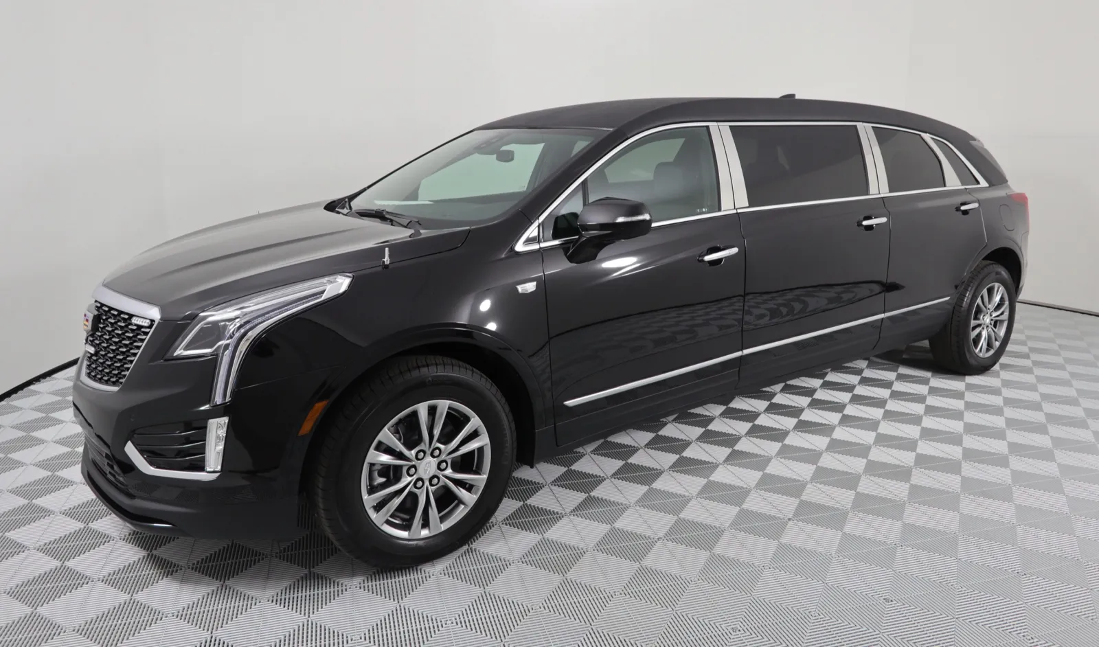 Sleek black Cadillac XT5 limousine showcasing modern design and luxury features.