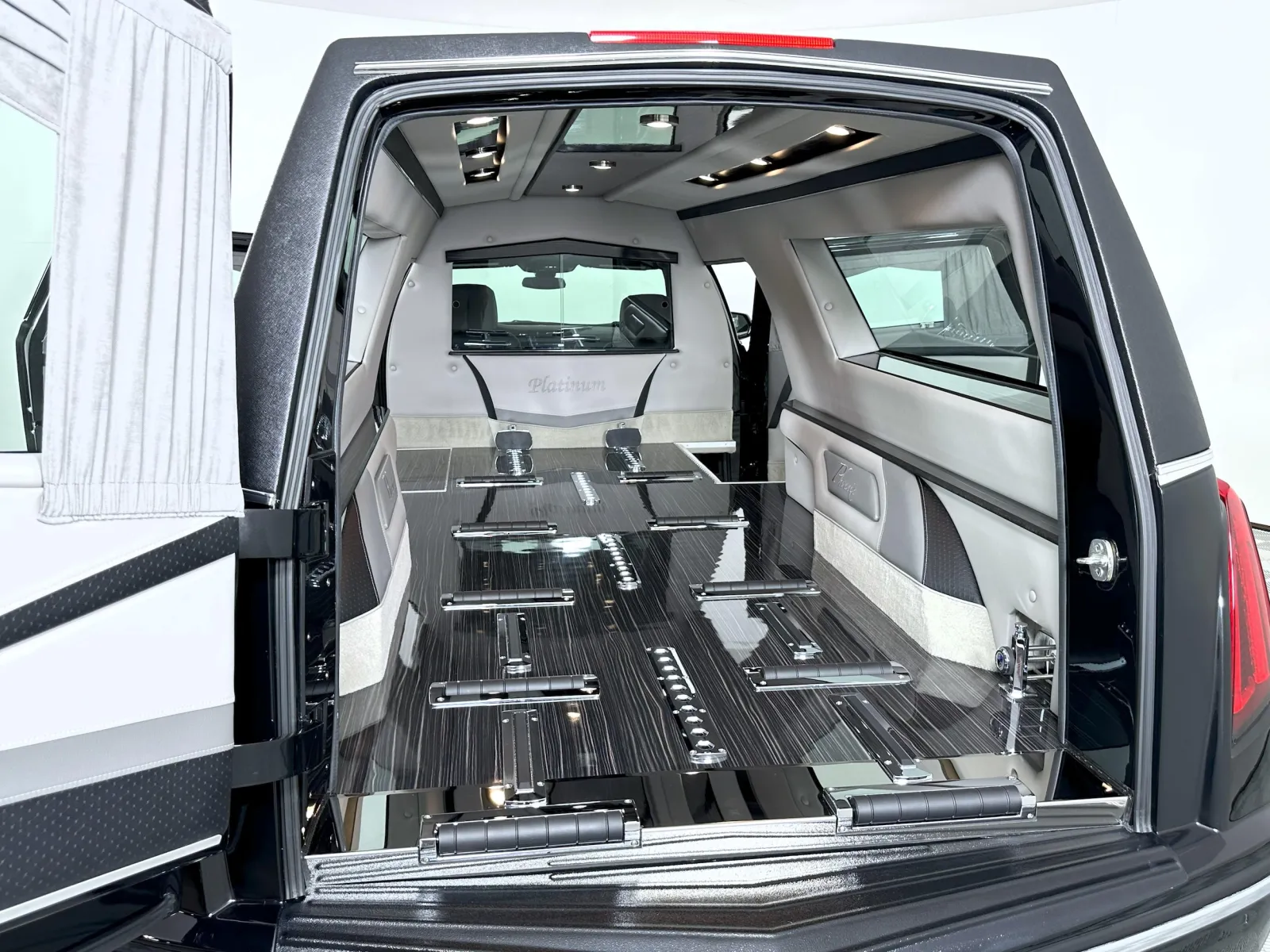 Luxurious hearse interior with polished wood and sleek design, emphasizing elegance and sophistication.
