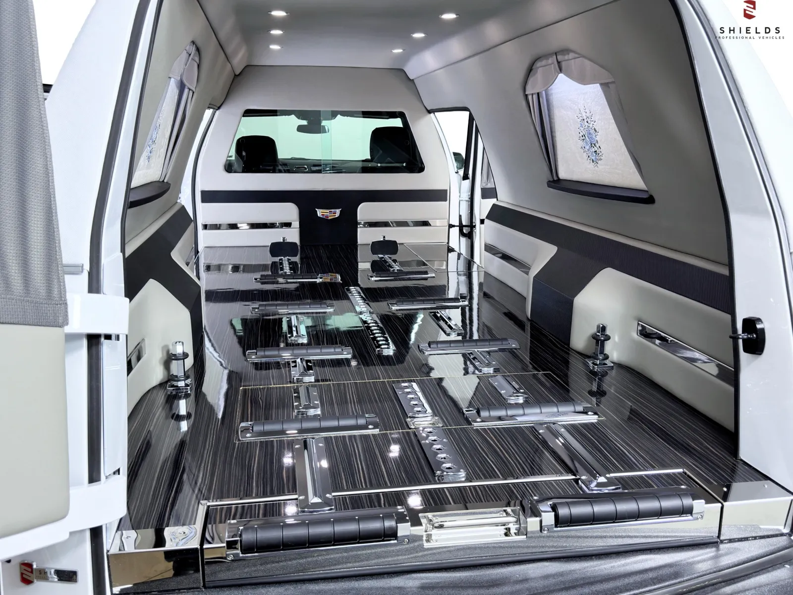 Stylish, spacious interior of a modern hearse with polished surfaces and sleek design.