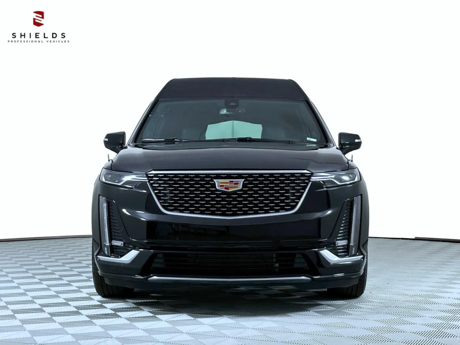 Front view of a sleek black Cadillac XT6 SUV showcasing its modern design and luxury features.