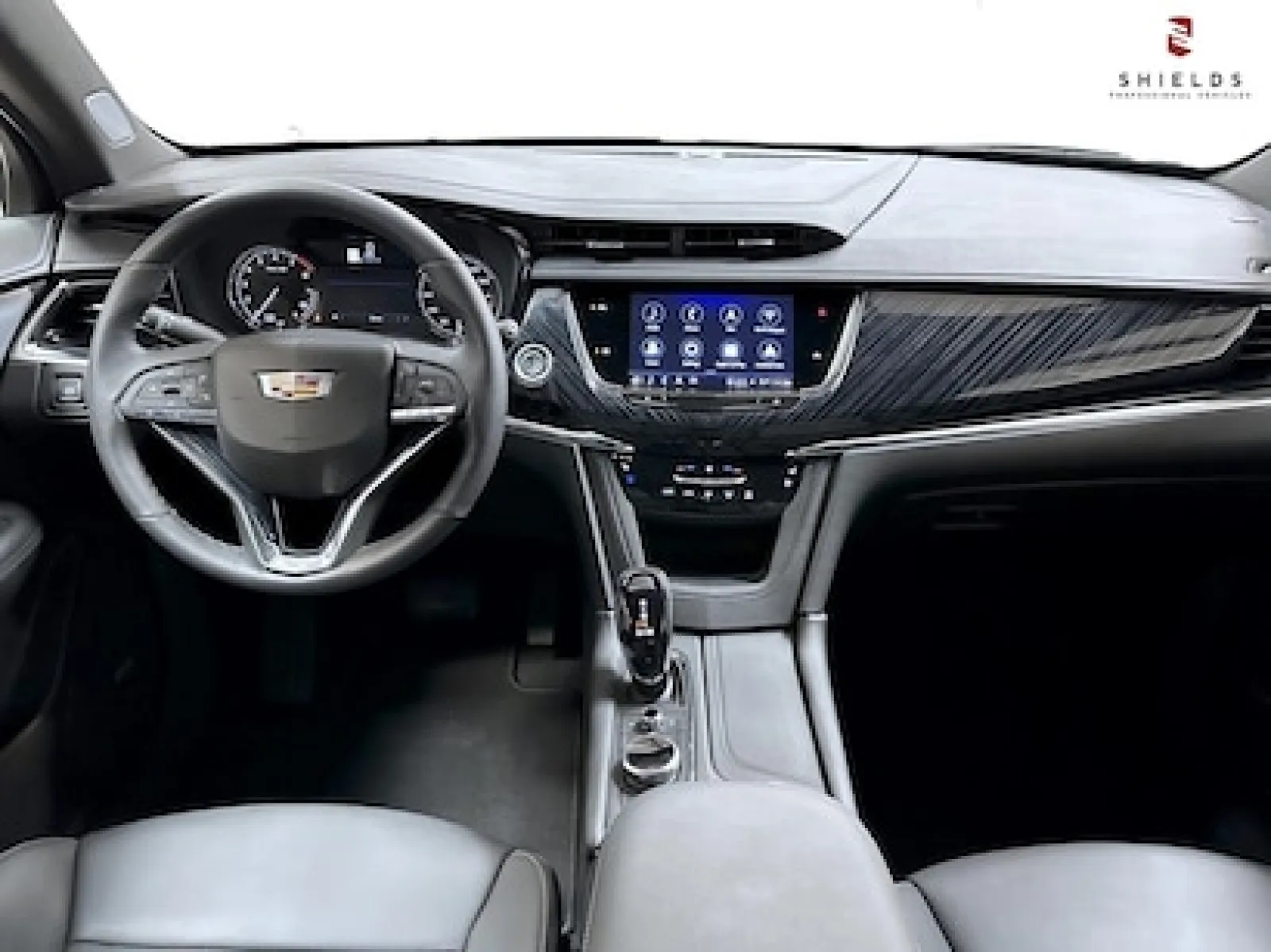 Interior view of a Cadillac showcasing a modern dashboard and elegant design elements.
