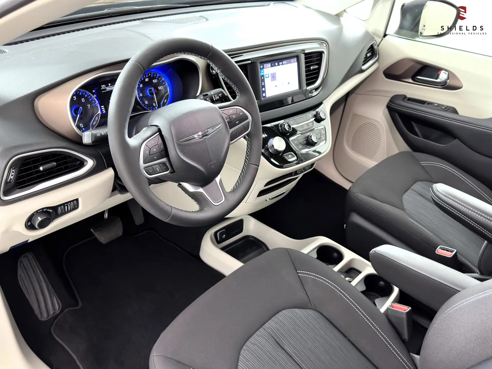 Interior view of a modern car showcasing dashboard, steering wheel, and seating design.