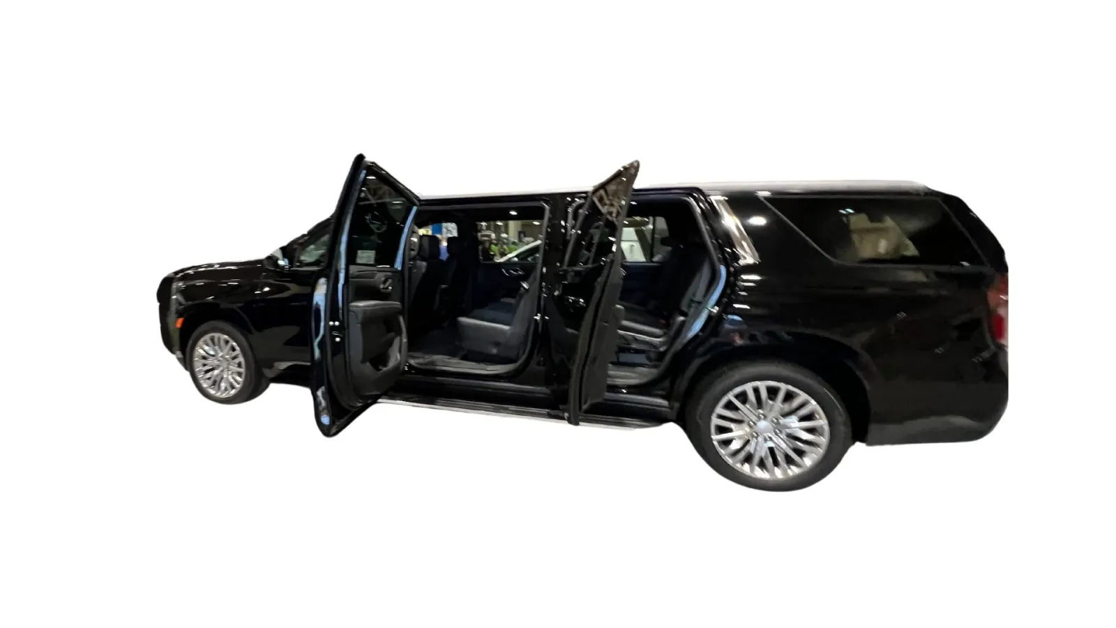 Black luxury SUV with doors open, showcasing spacious interior and modern design features.