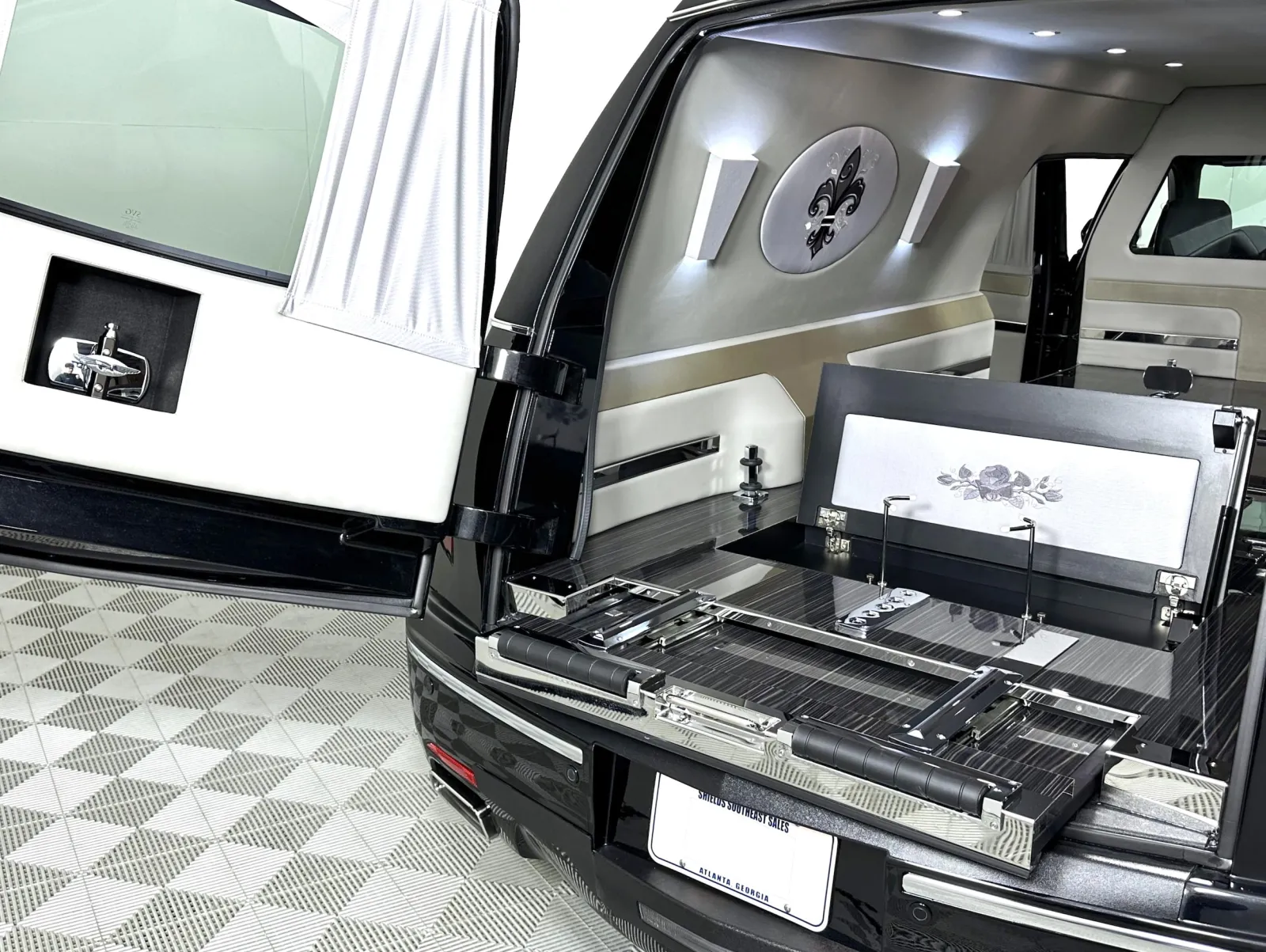 Interior of a stylish hearse with modern features and elegant design elements.