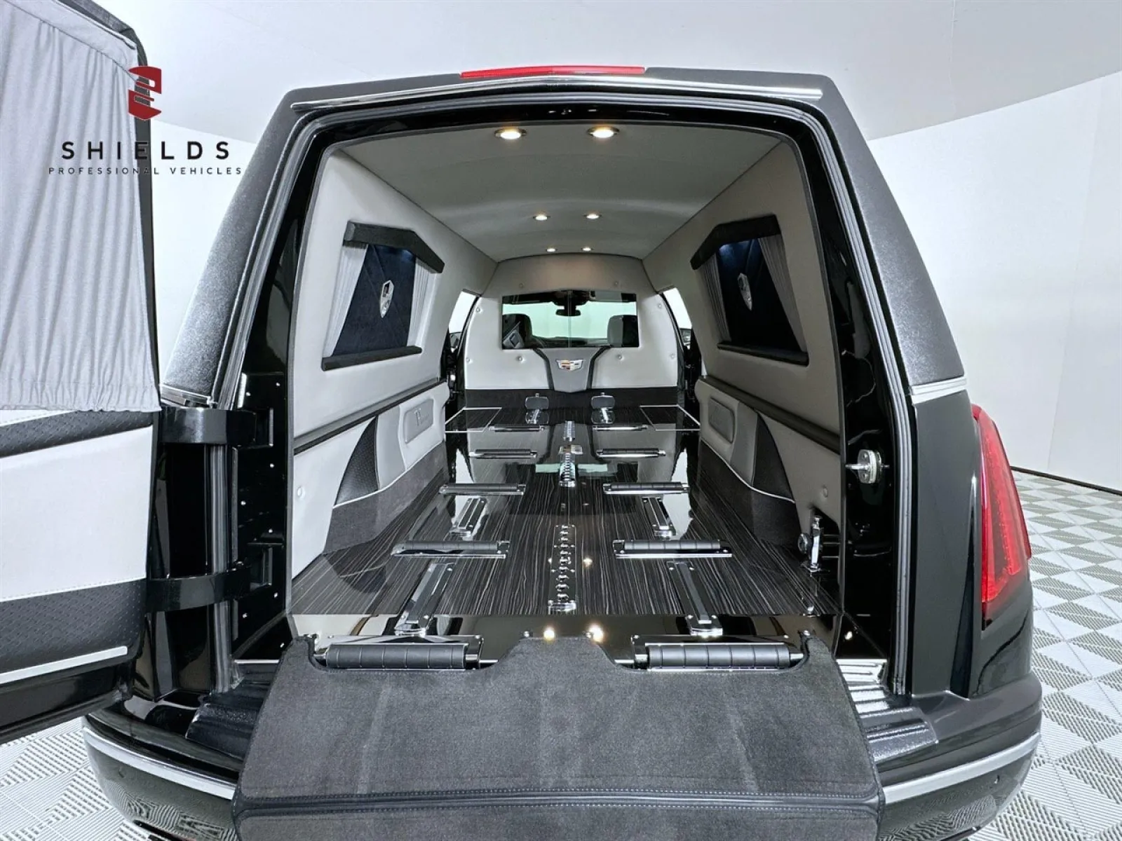 Interior view of a luxury hearse with spacious seating and elegant design features.