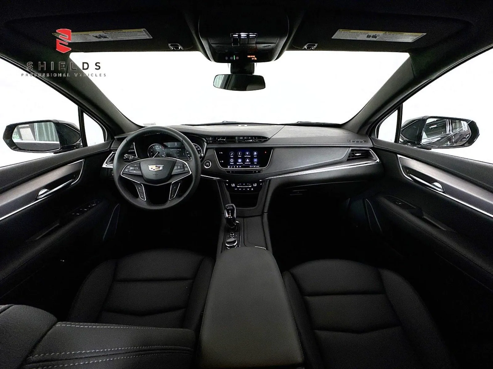 Interior view of a modern Cadillac showcasing sleek design and advanced technology features.