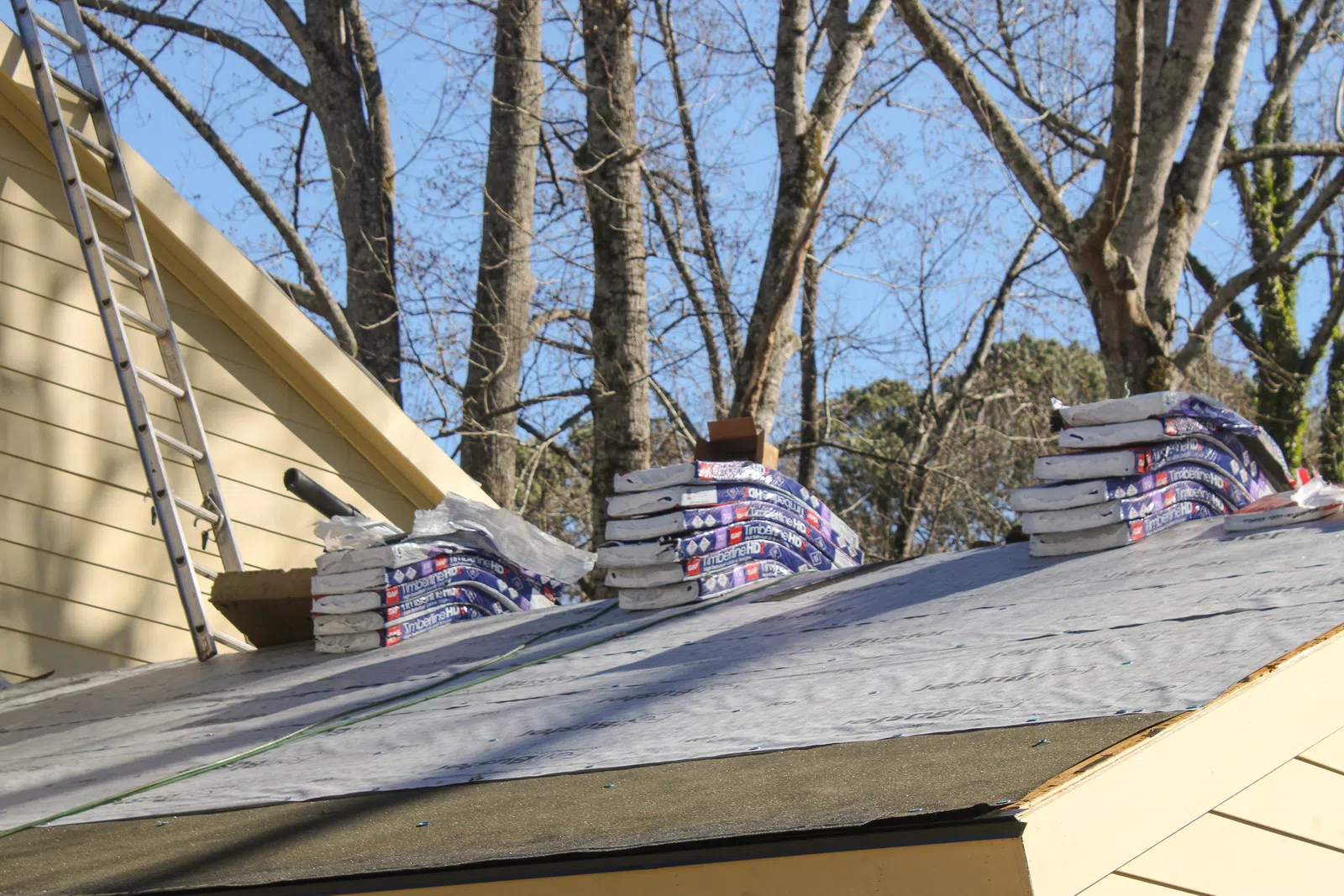Bundles of architectural shingles for roof replacement in Marietta by Nelson Exteriors
